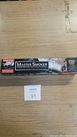 Photo of the Master Smoker box with branding and product image on front