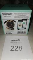 Box front showing Wonderwoof branding, image of dog with activity monitor, and touchscreen smartphone app display for activity tracking.