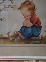 Close-up of child and worm illustration showing print details and colors.