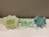 Three glass bowls placed side by side showing size and style comparison