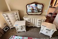 Full view of dresser, tall dresser and two nightstands arranged in bedroom corner