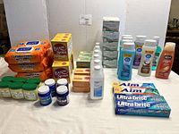 Full lot showing various personal hygiene products and cleaning supplies including wipes, petroleum jelly, baking soda, chest rub, soaps, toothpaste, shampoo.