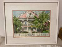 Framed watercolor painting whole view showing white frame and matting.