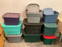 Three stack views showing assorted large plastic totes in different colors with matched lids.