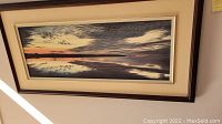 Overview of the framed giclee landscape print showing sunset with water reflection, in double mat and wood frame.