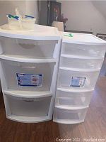 Two Sterilite plastic storage drawer units, one large with three drawers and one smaller with five drawers, shown side by side in a living space.