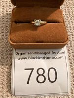 Ring in suede-lined jewelry box showing front view of solitaire