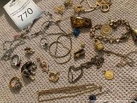 Overall view of assorted jewelry on carpet