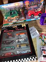 Photo showing Chevron Freddy 4-Wheeler green car, Chevron Rudy red car, and Racing Series I set of small die-cast cars in original packaging.