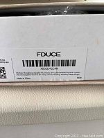 Label on FDUCE box showing wireless microphone karaoke system model X002LM2C4N, made in China, new condition