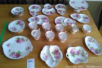 Overview of full china set including plates, cups and serving pieces