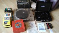Overview of all items including turntables, radio, 8-track tapes, and manuals.