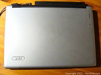 Closed top view of the silver Acer laptop showing the Acer logo on the lid.