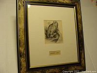 Framed snowy owl etching hung or placed against a white background, shows overall lot appearance, frame style, and size.
