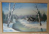 Framed oil painting showing overall winter landscape with birch trees, river and cabin.