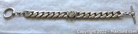 Full view of vintage sterling silver flat curb link bracelet with center cubic zirconia stone and T-bar clasp, measuring approx 7.5 inches long and 10 mm wide.