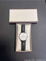 Front face of Daniel Wellington wristwatch in original beige box