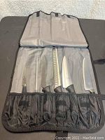 All six Mercer kitchen knives displayed in fabric carrying case, showing overall condition and layout