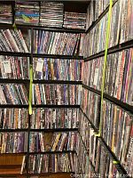 Full view of seven shelves packed with DVDs and Blu-rays from various genres and titles.