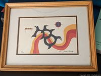 Photo of the framed Jackson Beardy print showing whole artwork and frame.