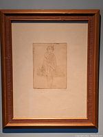 Framed etching artwork showing full frame and mat around the art.