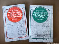 Front covers of Volume 1 and Volume 2 of the reference books showing titles, authors, and cover design