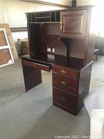 Front left side view showing drawers and hutch compartments