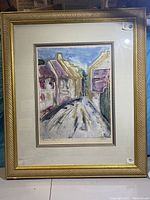 Full view of the framed artwork showing Italian Village street scene in watercolor or mixed media, signed by Joyce Combs.