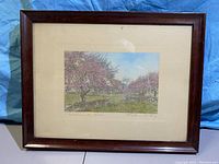 Full view of the framed artwork showing the title and overall condition of the frame and matte.