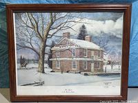 Front view of the framed print showing a winter scene with brick house, tree, and rider on horseback, signed Nicholas P Santoleri.