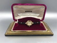 Front view of the Bulova wristwatch in the velvet-lined Gendis box showing the watch face and strap.