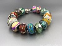 Full view of bracelet laid in a circle showing all bead styles