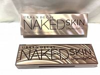 Closed Urban Decay Naked Skin Shapeshifter palette with box showing reflective rose-gold packaging and branding.