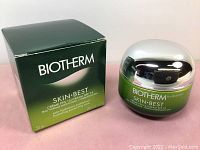 Green box and jar with silver lid labeled Biotherm Skin Best Cream SPF 15, 50 ml.