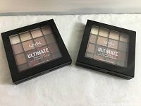 Photo showing two NYX Ultimate Shadow Palettes, sealed, with visible shades through clear window.