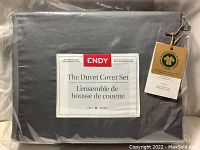 Sealed package front label of Endy duvet cover set showing product name, size (full/double), and material details.