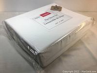 New sealed white packaged ENDY Queen size sheet set with 300 thread count and 100% organic cotton labels visible.