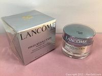 Photo showing the original box and sealed jar of the product with clear Lancôme branding.