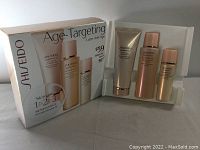 Full view of Shiseido Benefiance Age-Targeting skincare gift set box and three products displayed in plastic tray.