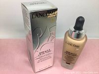 Photo of Lancôme Miracle Air de Teint product with box showing branding and product name.