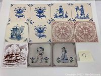Overview image of eleven vintage ceramic tiles arranged in rows, featuring floral, ship, and figure designs.