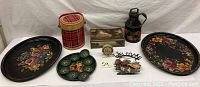 Overview of all items including tole trays, Uneeda biscuit box, jug, coaster set, box, and rooster welcome wall hanging