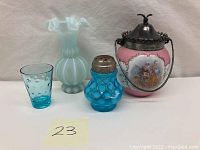 Overview of all four items: signed biscuit jar, frosted ruffled vase, Fenton aqua blue coin dot salt shaker, and matching aqua blue glass.