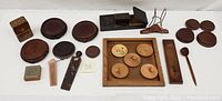 Overview of all vintage wooden accessories including coasters, tray, playing cards box, folding travel hanger, spoon, and oriental stands arranged for display.