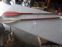 Two 5ft lightweight boat canoe paddles on a table.