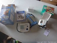 LifeSource blood pressure monitor unit, cuff, instruction booklet, and original box displayed on a table.