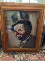 Frontal image of a large 3D clown painting in a wooden frame, signed by Meketi and Karla, showing the full artwork and frame.
