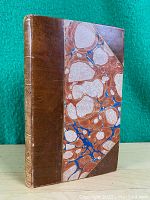 Front cover showing leather spine and marbled paper boards