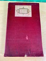 Front cover of the 1901 Universal Classic Manuscripts, showing wear, stains, and a printed label.