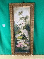 Full frontal view of the oil painting including frame on green background.